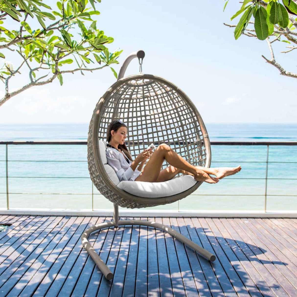 Dynasty Outdoor Hanging Chair with Frame and Sunbrella Cushion Model 23568-KMNP-CUSH by Skyline Design