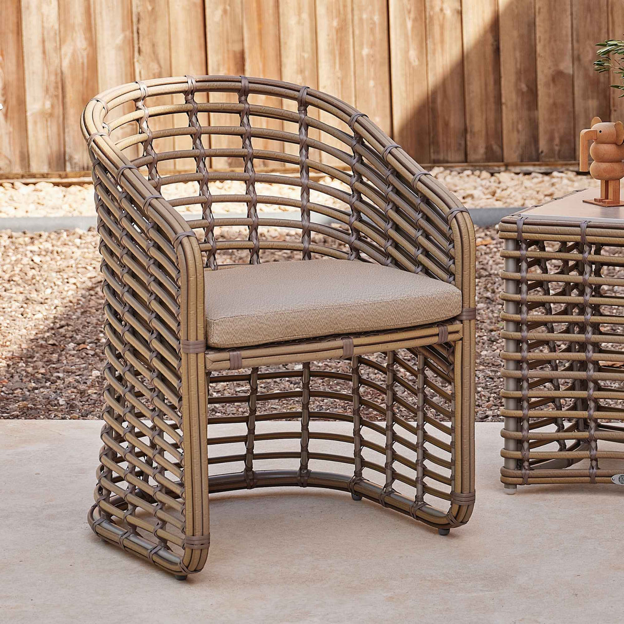 Ruby Outdoor Dining Armchair with Sunbrella Cushion Model 23671-KMNP-CUSH by Skyline Design
